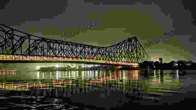 A Panoramic View Of The Iconic Howrah Bridge, Showcasing Its Architectural Marvel And The Vibrant Cityscape Beyond Chuchura To Howrah
