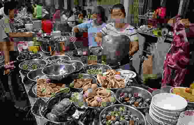 Mouthwatering Street Food Vendor Preparing A Dish In Saigon An Expedition To Saigon Wendi Friesen